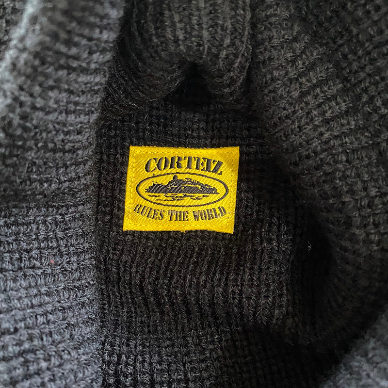 CAGOULE EN TRICOT CORTEIZ NOIR JAUNE