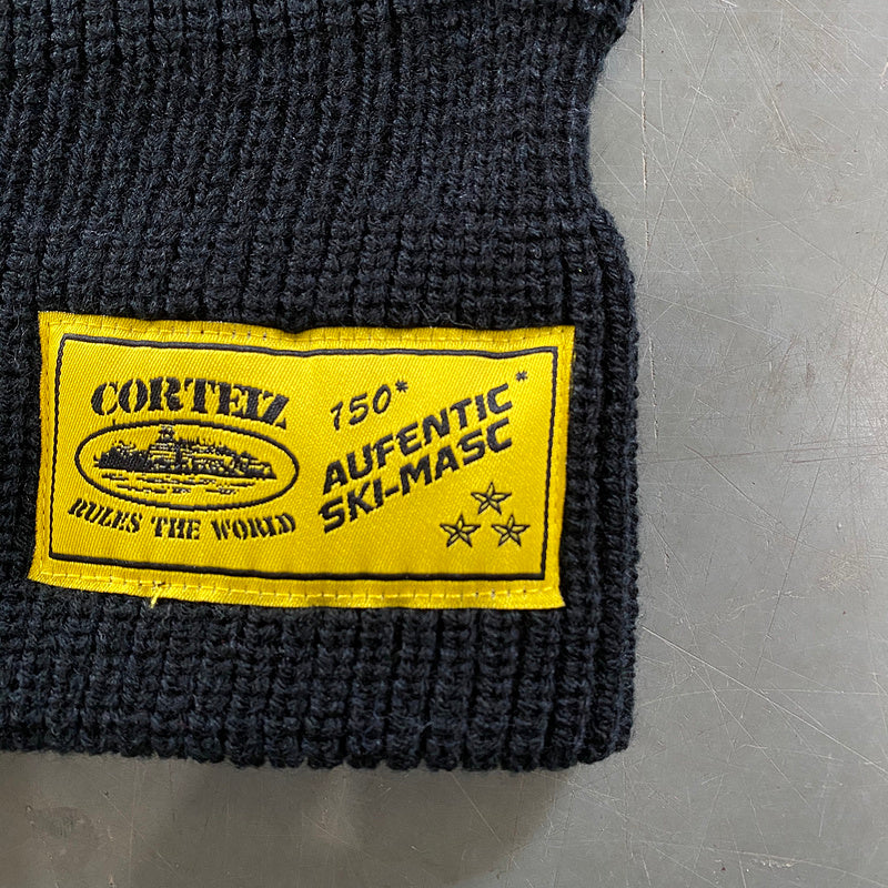 CAGOULE EN TRICOT CORTEIZ NOIR JAUNE